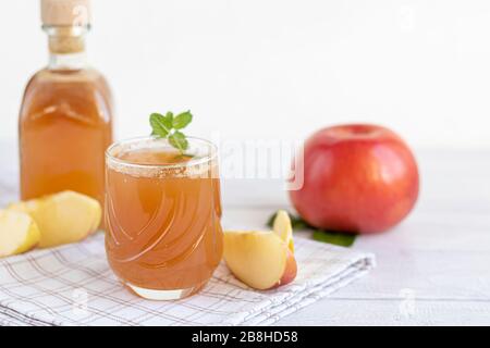 Freshly squeezed apple juice on a white background. Useful vitamin, antiviral drink. Copy space Stock Photo