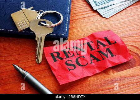 Rental scam memo about fraud and home key. Stock Photo