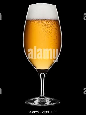 Fresh foamy beer in a glass on a black background with clipping path. Stock Photo