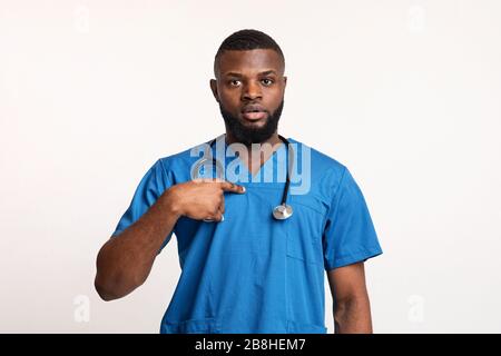 Surprised african male doctor pointing at himself Stock Photo
