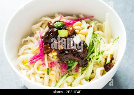 Bowl of Noodles with Soy Bean Paste in Beijing, China Bowl of Noodles with Soy Bean Paste in Beijing, China Stock Photo