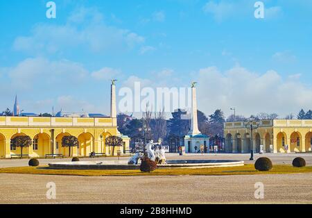 VIENNA, AUSTRIA - FEBRUARY 19, 2019: The main gate of Schonbrunn Palace is decorated with two slender columns, topped with golden eagles, on February Stock Photo