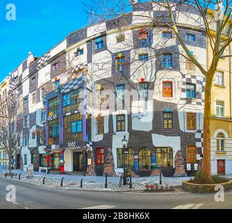 VIENNA, AUSTRIA - FEBRUARY 19, 2019: The beautiful facade of Hundertwasser museum (Kunst Haus Wien), decorated with black-white tilling, pillars, colo Stock Photo