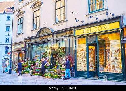 VIENNA, AUSTRIA - FEBRUARY 19, 2019: The vintage facade of the flower shop, located in Stephansplatz square and decorated with carved wooden panels an Stock Photo
