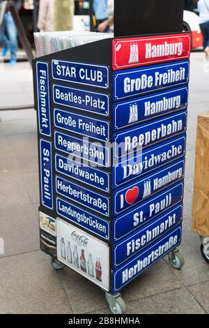 HAMBURG, GERMANY - MAY 12, 2018: Souvenir shields with famous Hamburger landmarks on it at a souvenir shop. Stock Photo
