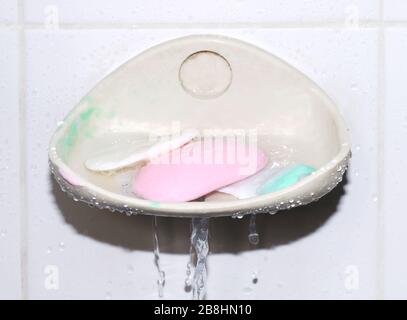 soap, soap bar on dish at wall, soap cubes used (selective focus) Stock Photo