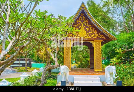 The beautiful wooden pavilion with fine golden ornaments and elephants, located in Laos garden in Rajapruek park, Chiang Mai, Thailand Stock Photo
