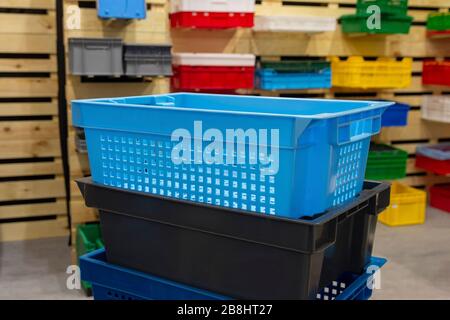Colored vegetable boxes plastic on stand. Agriculture Stock Photo