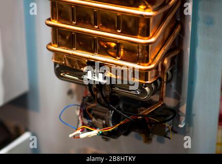 Electrical coil in the distribution panel with wires. Small electromagnet. Stock Photo