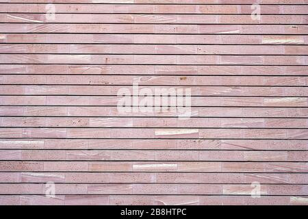 Background from a wall made of red granite slabs Stock Photo