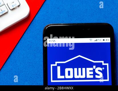 In this photo illustration Lowe’s logo is seen displayed on a smartphone Stock Photo