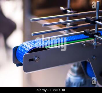 The conveyor chain, and conveyor belt is on production line in clean room Stock Photo