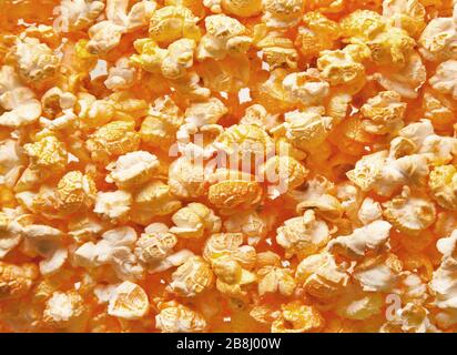 Salted popcorn grains against white background Stock Photo