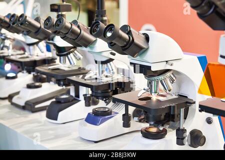 Optical microscopes in the store at the exhibition Stock Photo