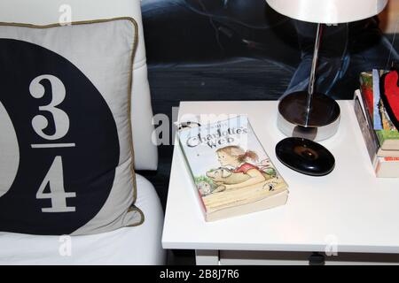A copy of Charlotte's Web sits on bedside table in childs bedroom Stock Photo