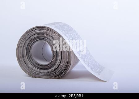 toilet paper made out of newspapers, alternative toilet paper, isolated on white, close-up, , newspaper roll Stock Photo