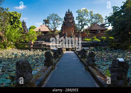 Lotus pond and Pura Saraswati temple (Ubud Water Palace) in Ubud, Bali, Indonesia. Stock Photo