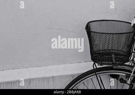Metallic black basket of an old rusted bike (Pesaro, Italy, Europe) Stock Photo