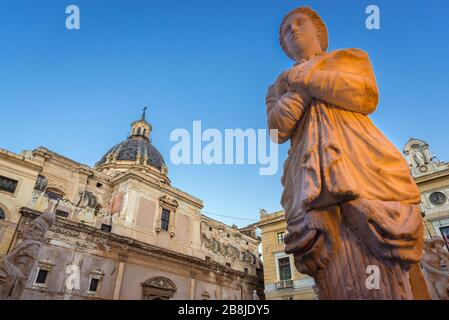 Statue of Praetorian Fountain on Piazza Pretoria also called Square of Shame in Palermo city in Italy, view with Saint Catherine church on background Stock Photo