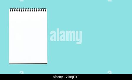 Open notebook isolated on blue. Blank notebook isolate Stock Photo