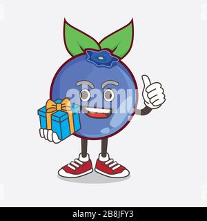 An illustration of Blueberry Fruit cartoon mascot character with gift Stock Photo