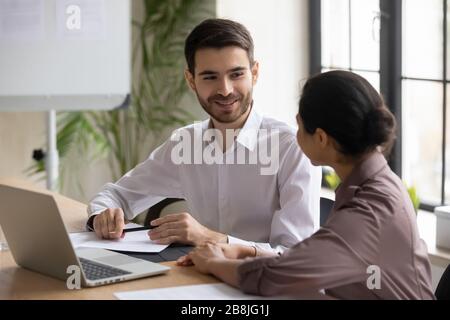 Multiracial colleagues brainstorm business ideas at office briefing Stock Photo