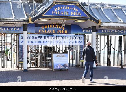 Brighton UK 22nd March 2020 - Brighton Palace Pier is closed to the public during the Coronavirus COVID-19 pandemic crisis  . Credit: Simon Dack / Alamy Live News Stock Photo