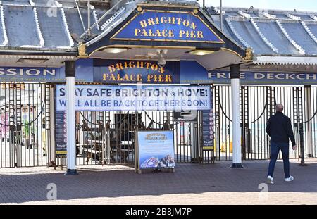 Brighton UK 22nd March 2020 - Brighton Palace Pier is closed to the public during the Coronavirus COVID-19 pandemic crisis  . Credit: Simon Dack / Alamy Live News Stock Photo