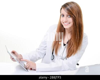 Pretty female student doctor working with an digital tablet Stock Photo