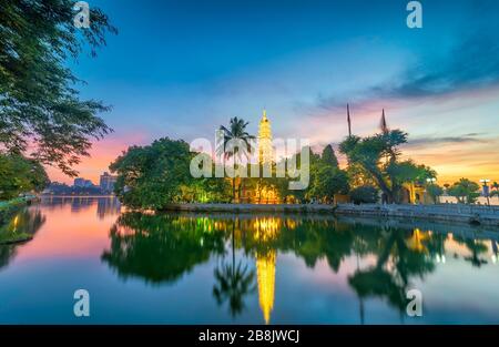 Tran Quoc pagoda in the afternoon in Hanoi, Vietnam. This pagoda locates on a small island near the southeastern shore of West Lake. This is the oldes Stock Photo