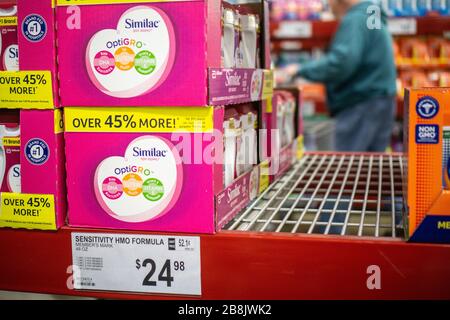 Berks County, Pennsylvania, USA-March 21, 2020: Infant Formula on sale at large warehouse store with empty shelves waiting for more supplies. Stock Photo