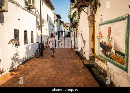 A young female tourist exploring the streets of Malacca, the popular historic town on Malaysia's west coast Stock Photo