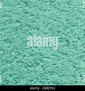 Textured fabric background in mint color. Background and texture for design. Textured fabric mint towel  background. Stock Photo