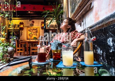 A young female tourist exploring the streets of Malacca, the popular historic town on Malaysia's west coast Stock Photo