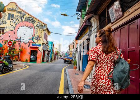 A young female tourist exploring the streets of Malacca, the popular historic town on Malaysia's west coast Stock Photo