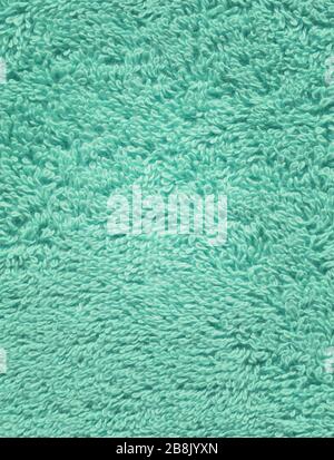 Textured fabric background in mint color. Background and texture for design. Textured fabric mint towel  background. Stock Photo