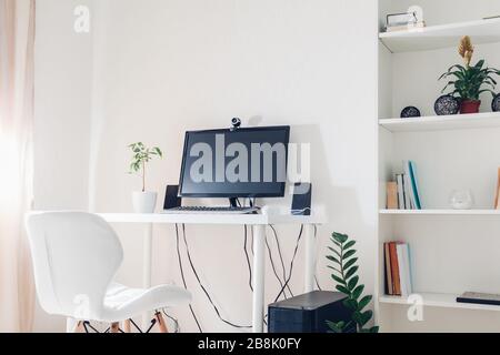 Work from home during coromavirus pandemic. Stay home. Workspace of freelancer. Office interior with computer Stock Photo