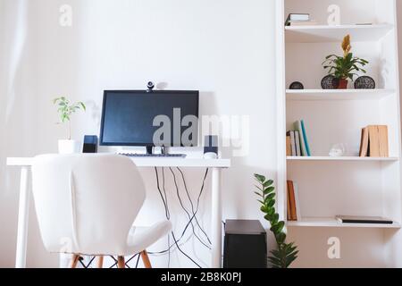 Work from home during coromavirus pandemic. Stay home. Workspace of freelancer. Office interior with computer Stock Photo