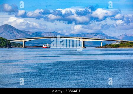 Vessel passing under he Skye Road Bridge connecting the Island of Skye at Kyleakin with the Scottish Mainland at Kyle of Lochalsh Highland Scotland Stock Photo