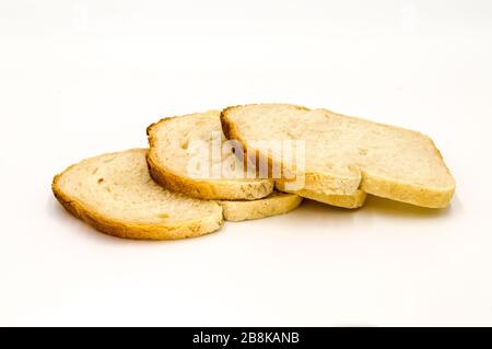 Wheat bread with bran slice. Cooking the dough. Isolated on white background. Stock Photo