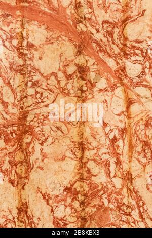 warm colored natural marble panel, natural beautiful marble in dark and warm colors, marble background texture, closeup Stock Photo