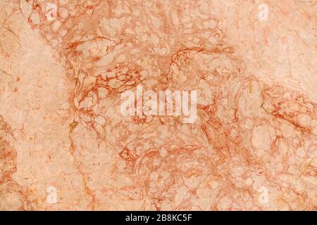warm colored natural marble panel, natural beautiful marble in dark and warm colors, marble background texture, closeup Stock Photo