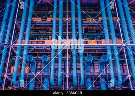 An abstract of blue pipes and yellow vents of the Centre Pompidou exterior, Paris, France Stock Photo