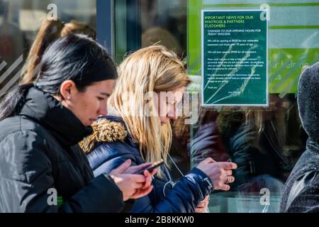 Some of the queue wear protective masks but there is still little sense that 'social distancing' is vital - Waitrose at Clapham Junction is only open to NHS workers and the over 70's for the first hour so a queue of regular customers waits outside - Anti Coronavirus (Covid 19) outbreak in London. Credit: Guy Bell/Alamy Live News Stock Photo