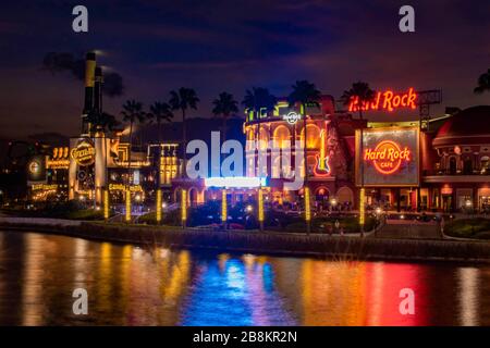 Orlando, Florida. February 12, 2020. Illuminated Hard Rock Cafe and Chocolate Emporium restaurant at Universals Citywalk Stock Photo