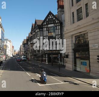 London UK Sunday 22 March 2020 Oxford Street Liberty Flag ship store on a lovey sunny day in London, usually teemingly with tourist and shoppers, has empty doors as toll on the British economy.Paul Quezada-Neiman/Alamy Live News Credit: Paul Quezada-Neiman/Alamy Live News Stock Photo