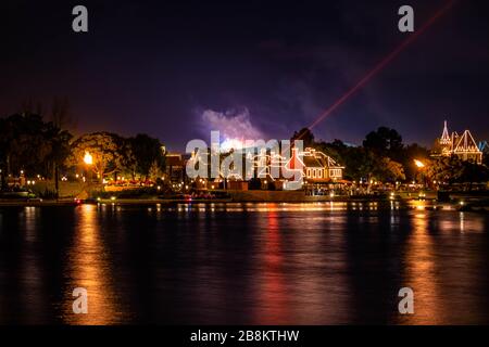 Orlando, Florida. March 11, 2020 Illuminated dockside and fireworks. at Epcot Stock Photo