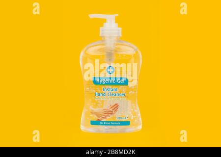 A bottle of hand sanitizer shot on a yellow background. Stock Photo