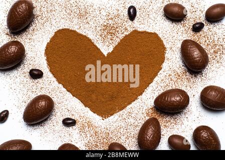 Chocolate Easter eggs and space for text made of cacao powder Stock Photo