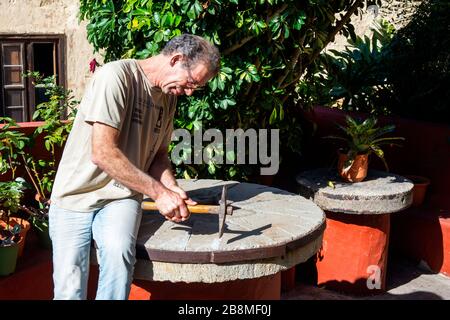 Shop and old water driven mill where toasted corn is ground to make a flour called gofio in a traditional manner in La Orotava, Tenerife Island, Canar Stock Photo